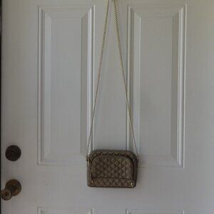 Steve Madden cross body mini purse matt gold with a gold tone chain zip closure
